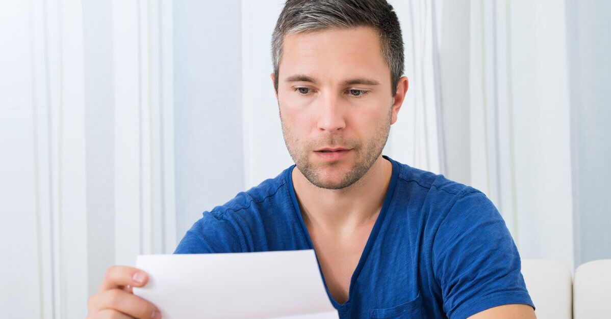 a man reads the instructions for using Predstonorm capsules